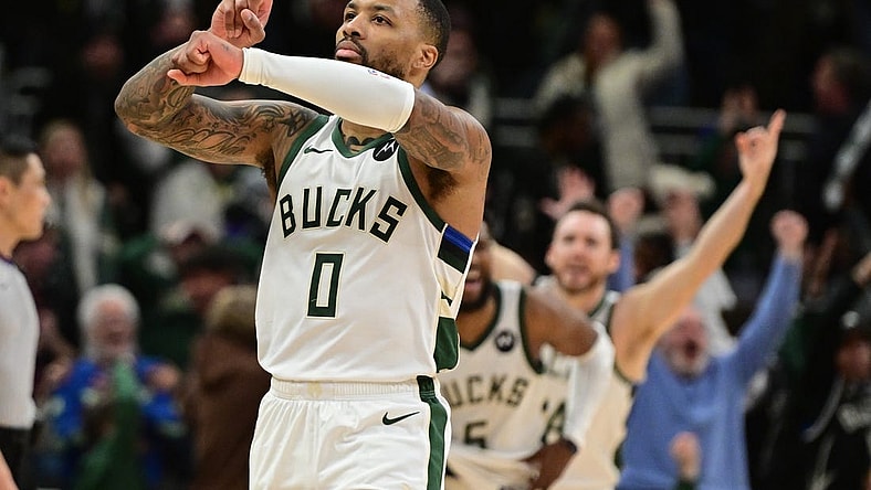 Jan 14, 2024; Milwaukee, Wisconsin, USA;  Milwaukee Bucks guard Damian Lillard (0) reacts after scoring the game-winning basket in overtime against the Sacramento Kings at Fiserv Forum. Mandatory Credit: Benny Sieu-USA TODAY Sports