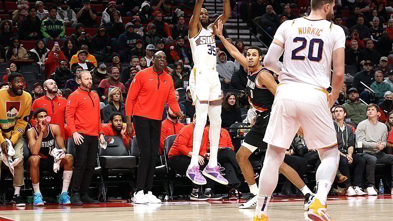 Jan 14, 2024; Portland, Oregon, USA; Phoenix Suns forward Kevin Durant (35) shoots a three-point shot over Portland Trail Blazers forward Kris Murray (8) as Phoenix Suns center Jusuf Nurkic (20) looks on in the fourth quarter at Moda Center. Mandatory Credit: Jaime Valdez-USA TODAY Sports