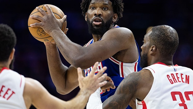 Jan 15, 2024; Philadelphia, Pennsylvania, USA; Philadelphia 76ers center Joel Embiid (21) controls the ball against Houston Rockets forward Jeff Green (32) during the second quarter at Wells Fargo Center. Mandatory Credit: Bill Streicher-USA TODAY Sports