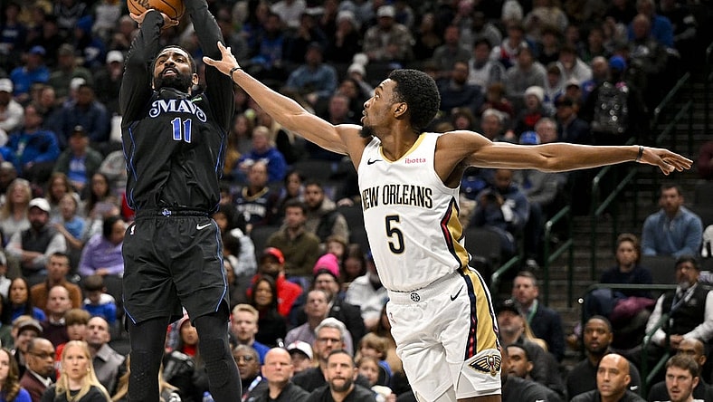 Jan 15, 2024; Dallas, Texas, USA; Dallas Mavericks guard Kyrie Irving (11) shoots the ball over New Orleans Pelicans forward Herbert Jones (5) during the second quarter at the American Airlines Center. Mandatory Credit: Jerome Miron-USA TODAY Sports
