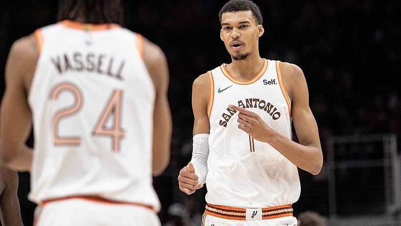 Jan 15, 2024; Atlanta, Georgia, USA; San Antonio Spurs center Victor Wembanyama (1) talks to teammate guard Devin Vassell (24) in the game against Atlanta Hawks during the first quarter at State Farm Arena. Mandatory Credit: Jordan Godfree-USA TODAY Sports