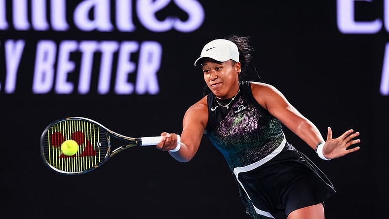 Jan 15, 2024; Melbourne, Victoria, Australia; Naomi Osaka of Japan plays a shot against Caroline Garcia (not pictured) of France in Round 1 of the Women's Singles on Day 2 of the Australian Open tennis at Rod Laver Arena. Mandatory Credit: Mike Frey-USA TODAY Sports