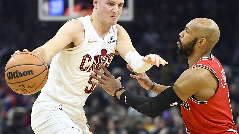 Jan 15, 2024; Cleveland, Ohio, USA; Cleveland Cavaliers guard Sam Merrill (5) dribbles beside Chicago Bulls guard Jevon Carter (5) in the second quarter at Rocket Mortgage FieldHouse. Mandatory Credit: David Richard-USA TODAY Sports