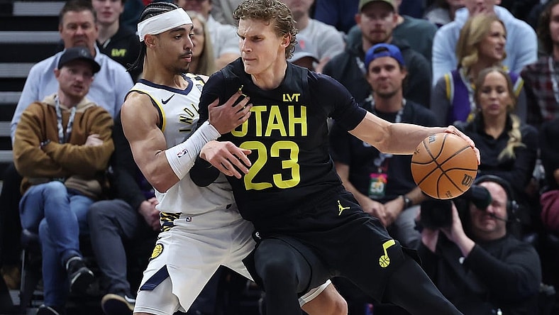 Jan 15, 2024; Salt Lake City, Utah, USA; Utah Jazz forward Lauri Markkanen (23) dribbles against Indiana Pacers guard Andrew Nembhard (2) during the first quarter at Delta Center. Mandatory Credit: Rob Gray-USA TODAY Sports