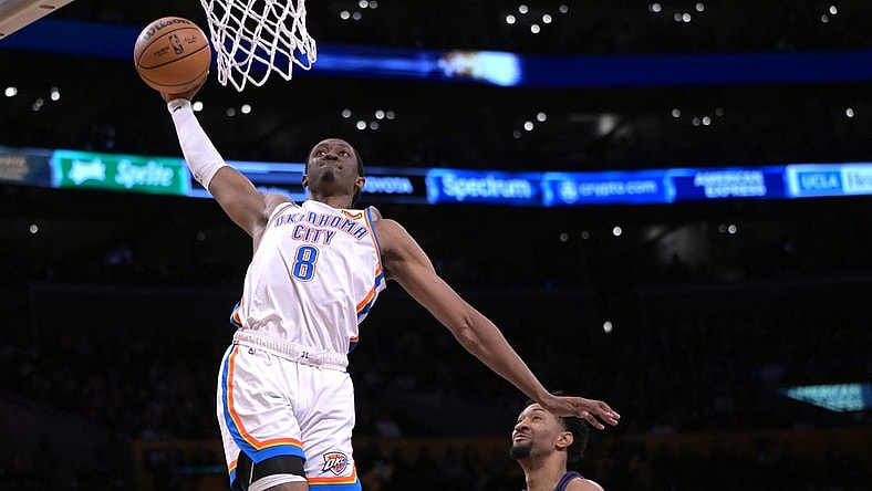 Jan 15, 2024; Los Angeles, California, USA; Oklahoma City Thunder forward Jalen Williams (8) scores past Los Angeles Lakers forward Christian Wood (35) in the second half against at Crypto.com Arena. Mandatory Credit: Jayne Kamin-Oncea-USA TODAY Sports