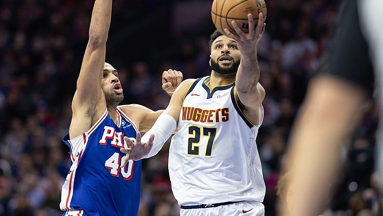 Jan 16, 2024; Philadelphia, Pennsylvania, USA; Denver Nuggets guard Jamal Murray (27) drives for a score past Philadelphia 76ers forward Nicolas Batum (40) during the second quarter at Wells Fargo Center. Mandatory Credit: Bill Streicher-USA TODAY Sports