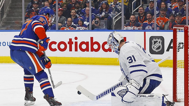 Jan 16, 2024; Edmonton, Alberta, CAN; Toronto Maple Leafs goaltender Martin Jones (31) makes a save on one Edmonton Oilers forward Connor McDavid (97) during the first period at Rogers Place. Mandatory Credit: Perry Nelson-USA TODAY Sports