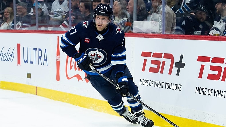 Jan 16, 2024; Winnipeg, Manitoba, CAN; Winnipeg Jets forward Nikolaj Ehlers (27) looks to make a pass against the New York Islanders during the first period at Canada Life Centre. Mandatory Credit: Terrence Lee-USA TODAY Sports