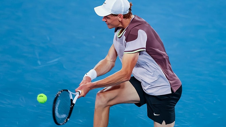 Jan 17, 2024; Melbourne, Victoria, Australia; Jannik Sinner of Italy plays a shot against Jesper de Jong (not pictured) of Netherlands in Round 2 of the Men's Singles on Day 4 of the Australian Open tennis at Rod Laver Arena.Mandatory Credit: Mike Frey-USA TODAY Sports