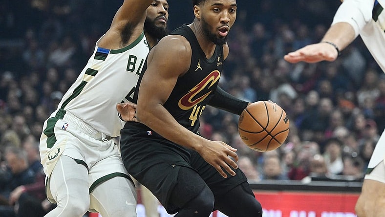 Jan 17, 2024; Cleveland, Ohio, USA; Cleveland Cavaliers guard Donovan Mitchell (45) drives to the basket against Milwaukee Bucks guard Malik Beasley (5) during the first half at Rocket Mortgage FieldHouse. Mandatory Credit: Ken Blaze-USA TODAY Sports