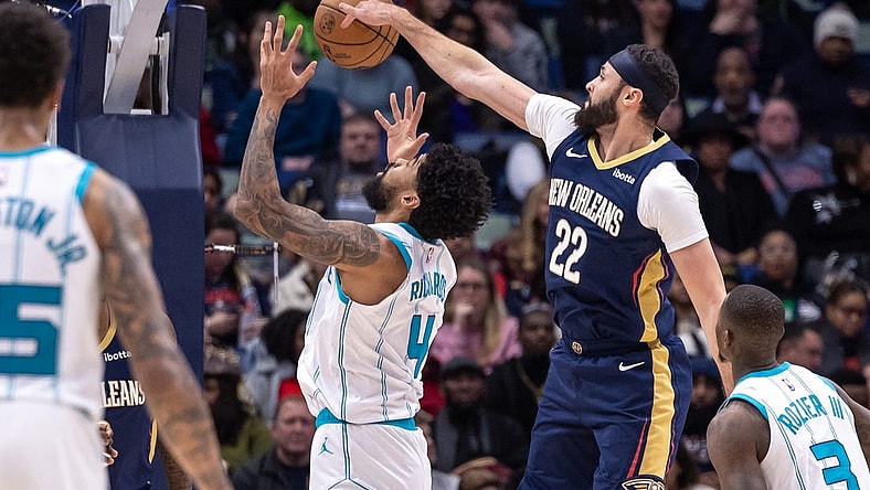 Jan 17, 2024; New Orleans, Louisiana, USA;  New Orleans Pelicans forward Larry Nance Jr. (22) blocks the shot of Charlotte Hornets center Nick Richards (4) during the first half at Smoothie King Center. Mandatory Credit: Stephen Lew-USA TODAY Sports