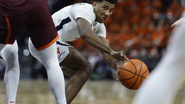 Jan 17, 2024; Charlottesville, Virginia, USA; Virginia Cavaliers guard Reece Beekman (2) passes the ball against the Virginia Tech Hokies in the second half at John Paul Jones Arena. Mandatory Credit: Geoff Burke-USA TODAY Sports
