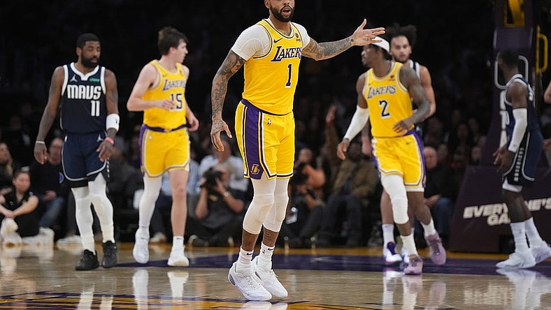 Jan 17, 2024; Los Angeles, California, USA; Los Angeles Lakers guard D'Angelo Russell (1) gestures after a three-point basket against the Dallas Mavericks in the first half at Crypto.com Arena. Mandatory Credit: Kirby Lee-USA TODAY Sports