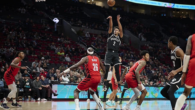 Jan 17, 2024; Portland, Oregon, USA; Brooklyn Nets forward Cameron Johnson (2) shoots a basket during the first half against Portland Trail Blazers center Duop Reath (26) at Moda Center. Mandatory Credit: Troy Wayrynen-USA TODAY Sports