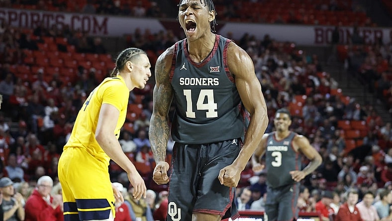 Jan 17, 2024; Norman, Oklahoma, USA; Oklahoma Sooners forward Jalon Moore (14) celebrates after scoring against the West Virginia Mountaineers during the second half at Lloyd Noble Center. Mandatory Credit: Alonzo Adams-USA TODAY Sports