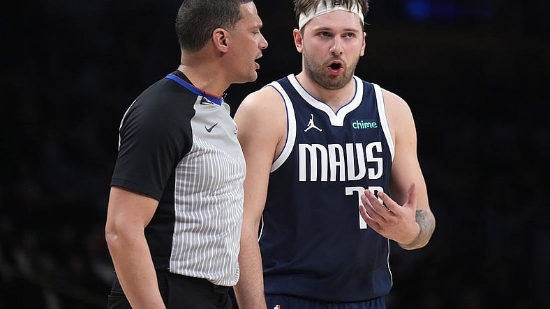 Jan 17, 2024; Los Angeles, California, USA; Dallas Mavericks guard Luka Doncic (77) reacts to a call by referee Nate Green in the second half against the Los Angeles Lakers at Crypto.com Arena. Mandatory Credit: Kirby Lee-USA TODAY Sports