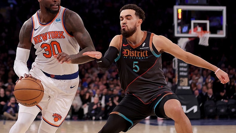 Jan 18, 2024; New York, New York, USA; New York Knicks forward Julius Randle (30) drives to the basket against Washington Wizards guard Tyus Jones (5) during the second quarter at Madison Square Garden. Mandatory Credit: Brad Penner-USA TODAY Sports