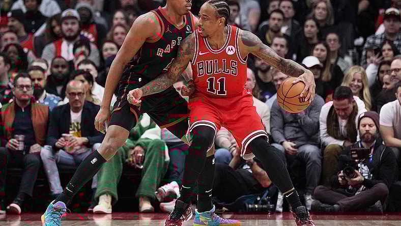 Jan 18, 2024; Toronto, Ontario, CAN; Chicago Bulls forward DeMar DeRozan (11) controls the ball as Toronto Raptors forward Scottie Barnes (4) tries to defend during the second quarter at Scotiabank Arena. Mandatory Credit: Nick Turchiaro-USA TODAY Sports