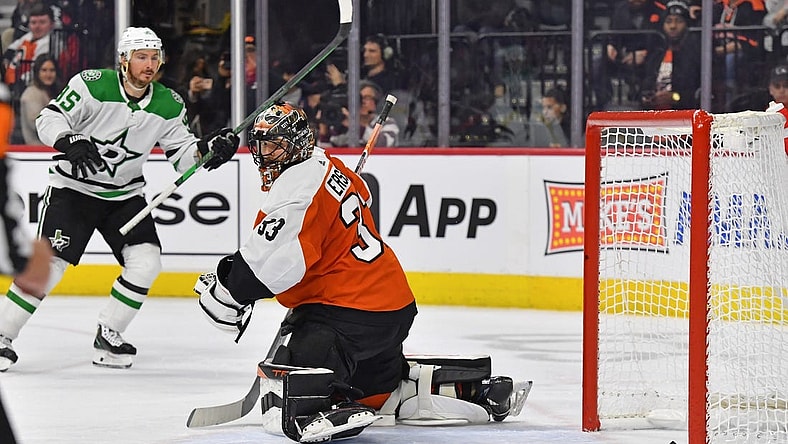 Jan 18, 2024; Philadelphia, Pennsylvania, USA; Philadelphia Flyers goaltender Samuel Ersson (33) looks behind on goal scored by Dallas Stars center Tyler Seguin (91) (not pictured) during the second period at Wells Fargo Center. Mandatory Credit: Eric Hartline-USA TODAY Sports