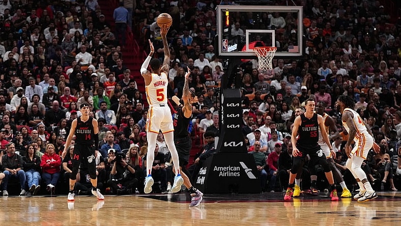 Jan 19, 2024; Miami, Florida, USA; Atlanta Hawks guard Dejounte Murray (5) attempts a three point shot against the Miami Heat during the first half at Kaseya Center. Mandatory Credit: Jasen Vinlove-USA TODAY Sports
