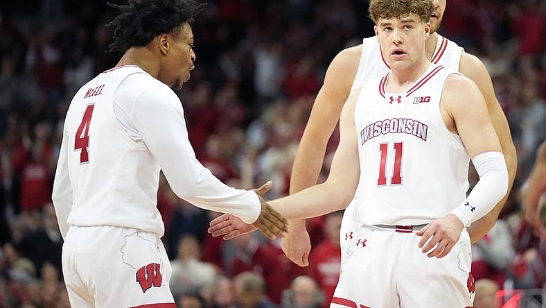 Jan 19, 2024; Madison, Wisconsin, USA; Wisconsin Badgers guard Max Klesmit (11) celebrates a three point basket with Wisconsin Badgers guard Kamari McGee (4) during the second half against the Indiana Hoosiers at the Kohl Center. Mandatory Credit: Kayla Wolf-USA TODAY Sports