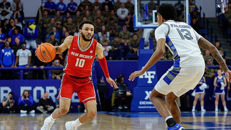 Jan 20, 2024; Colorado Springs, Colorado, USA; New Mexico Lobos guard Jaelen House (10) controls the ball as Air Force Falcons forward Chase Beasley (13) guards in the first half at Clune Arena. Mandatory Credit: Isaiah J. Downing-USA TODAY Sports