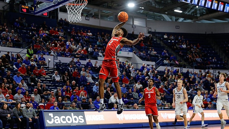 Jan 20, 2024; Colorado Springs, Colorado, USA; New Mexico Lobos guard Donovan Dent (2) dunks the ball in the second half against the Air Force Falcons at Clune Arena. Mandatory Credit: Isaiah J. Downing-USA TODAY Sports