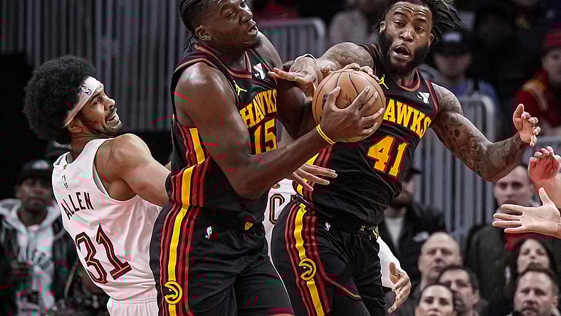Jan 20, 2024; Atlanta, Georgia, USA; Atlanta Hawks center Clint Capela (15) and forward Saddiq Bey (41) fight for a rebound with Cleveland Cavaliers center Jarrett Allen (31) during the first half at State Farm Arena. Mandatory Credit: Dale Zanine-USA TODAY Sports