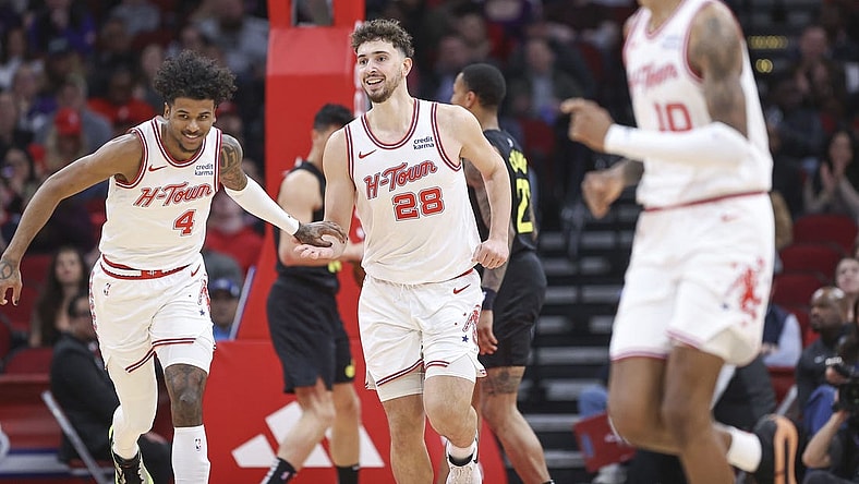 Jan 20, 2024; Houston, Texas, USA; Houston Rockets center Alperen Sengun (28) smiles after scoring a basket during the second quarter against the Utah Jazz at Toyota Center. Mandatory Credit: Troy Taormina-USA TODAY Sports