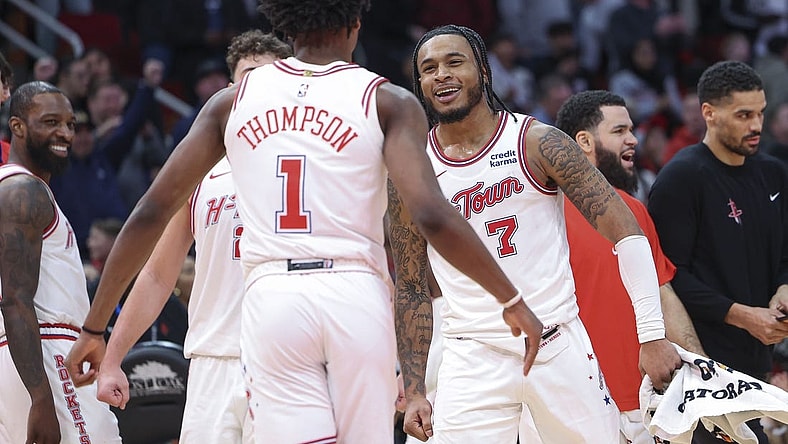 Jan 20, 2024; Houston, Texas, USA; Houston Rockets forward Cam Whitmore (7) celebrates with forward Amen Thompson (1) after a play during overtime against the Utah Jazz at Toyota Center. Mandatory Credit: Troy Taormina-USA TODAY Sports