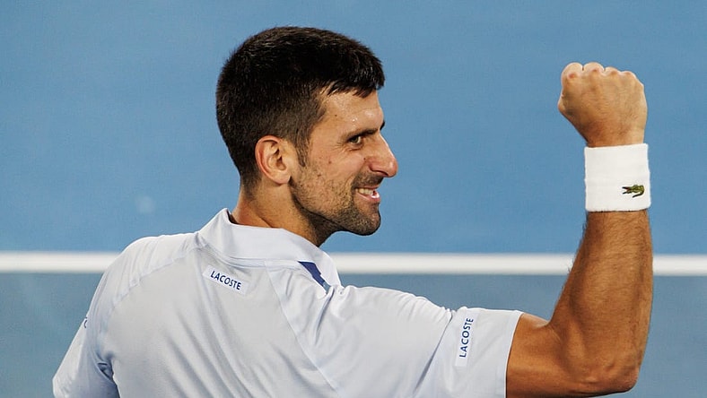 Jan 21, 2024; Melbourne, Victoria, Australia; Novak Djokovic of Serbia celebrates his victory over Adrian Mannarino of France in the forth round of the men s singles at the Australian Open 2024. Mandatory Credit: Mike Frey-USA TODAY Sports