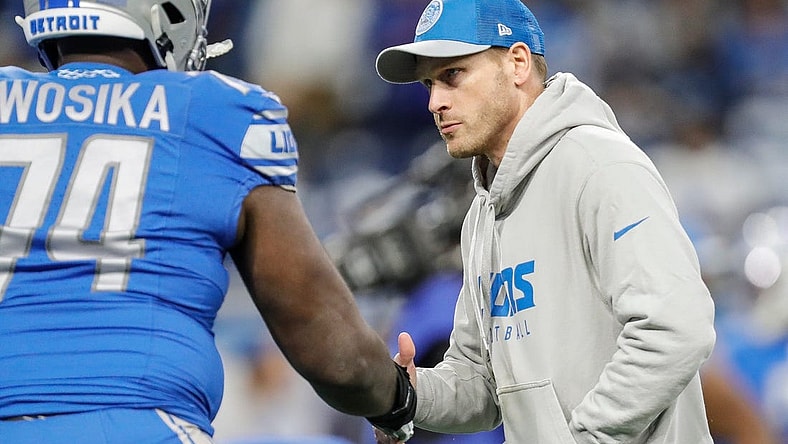 Lions offensive coordinator Ben Johnson shakes hands with guard Kayode Awosika during warmups before the NFC divisional playoff game between the Lions and Buccaneers at Ford Field on Sunday, Jan, 21, 2024.
