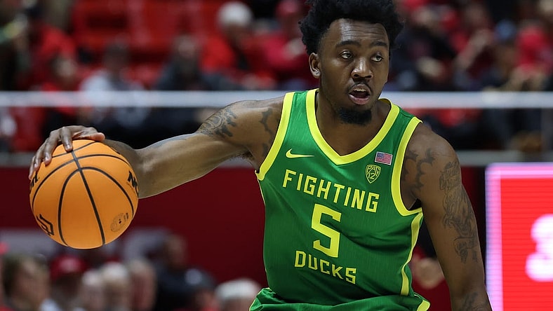 Jan 21, 2024; Salt Lake City, Utah, USA; Oregon Ducks guard Jermaine Couisnard (5) dribbles the ball against the Utah Utes during the first half at Jon M. Huntsman Center. Mandatory Credit: Rob Gray-USA TODAY Sports