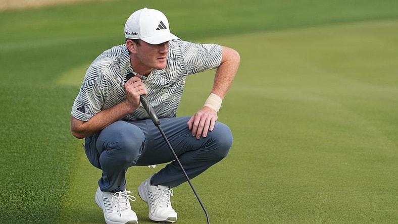 Jan 21, 2024; La Quinta, California, USA; Nick Dunlap lines up a putt on the third green during the final round of The American Express golf tournament at PGA West Stadium Course. Mandatory Credit: Ray Acevedo-USA TODAY Sports
