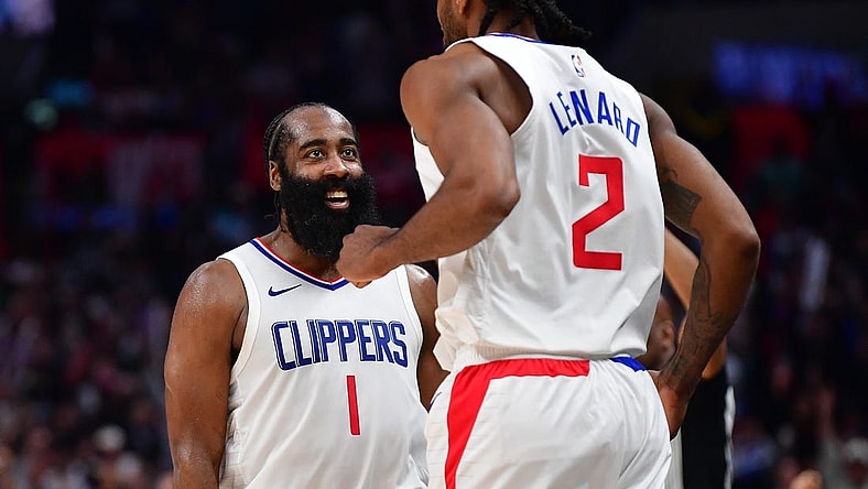 Jan 21, 2024; Los Angeles, California, USA; Los Angeles Clippers guard James Harden (1) reacts after forward Kawhi Leonard (2) scores three point basket against the Brooklyn Nets during the second half at Crypto.com Arena. Mandatory Credit: Gary A. Vasquez-USA TODAY Sports