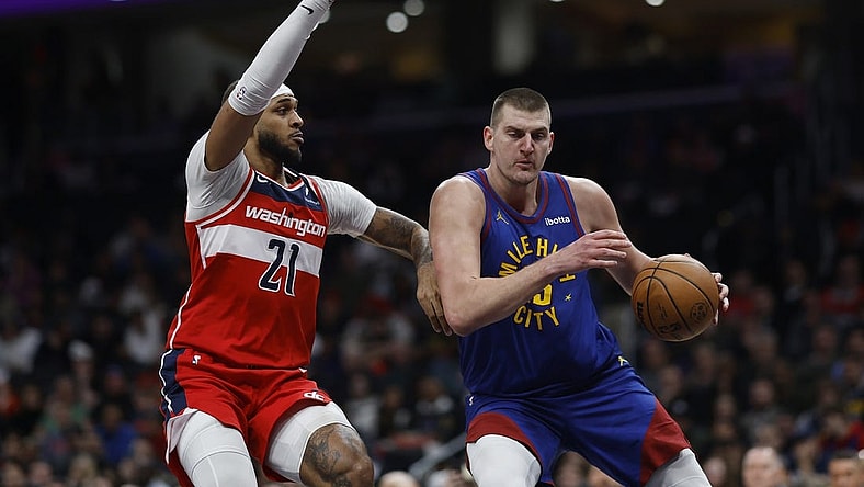 Jan 21, 2024; Washington, District of Columbia, USA; Denver Nuggets center Nikola Jokic (15) drives to the basket as Washington Wizards center Daniel Gafford (21) defends in the first half at Capital One Arena. Mandatory Credit: Geoff Burke-USA TODAY Sports
