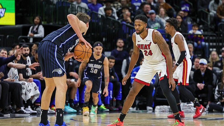 Jan 21, 2024; Orlando, Florida, USA; Miami Heat forward Haywood Highsmith (24) defends Orlando Magic forward Franz Wagner (22) during the second quarter at Amway Center. Mandatory Credit: Mike Watters-USA TODAY Sports