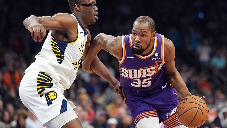 Jan 21, 2024; Phoenix, Arizona, USA; Phoenix Suns forward Kevin Durant (35) dribbles against Indiana Pacers forward Jalen Smith (25) during the first half at Footprint Center. Mandatory Credit: Joe Camporeale-USA TODAY Sports