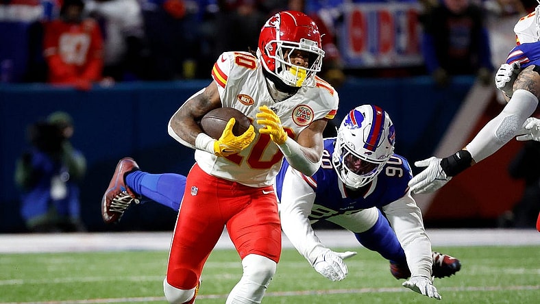 Kansas City Chiefs running back Isiah Pacheco (10) beats a tackle.