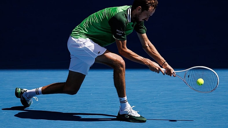 Jan 22, 2024; Melbourne, Victoria, Australia; Daniil Medvedev of Russia hits a shot against Nuno Borges of Portugal in the fourth round of the men   s singles at the Australian Open in Melbourne. Mandatory Credit: Mike Frey-USA TODAY Sports