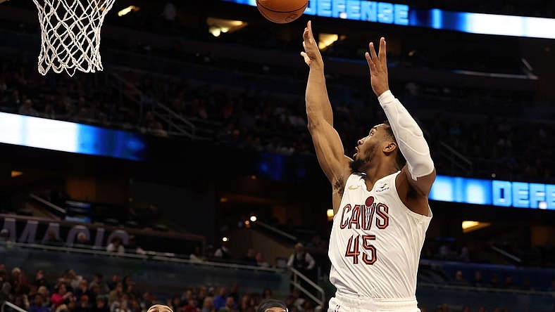 Jan 22, 2024; Orlando, Florida, USA; Cleveland Cavaliers guard Donovan Mitchell (45) makes a jump shot against the Orlando Magic during the second quarter at Kia Center. Mandatory Credit: Kim Klement Neitzel-USA TODAY Sports