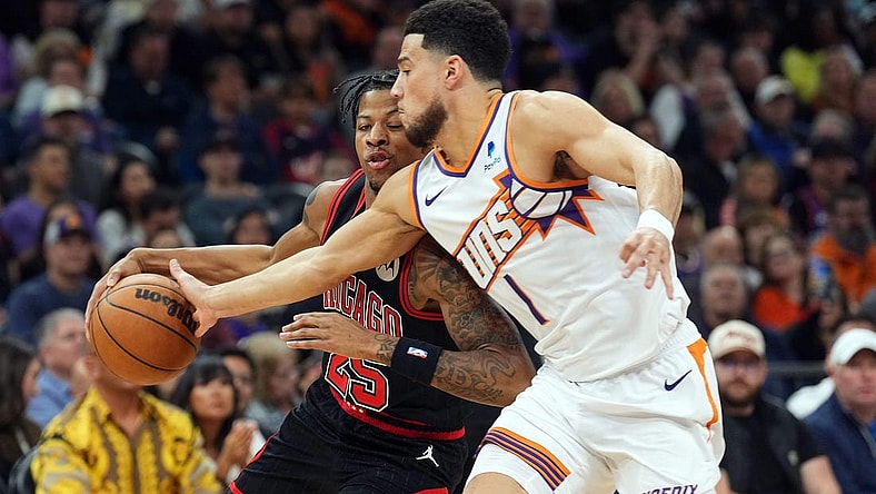 Jan 22, 2024; Phoenix, Arizona, USA; Phoenix Suns guard Devin Booker (1) guards Chicago Bulls forward Dalen Terry (25) during the first half at Footprint Center. Mandatory Credit: Joe Camporeale-USA TODAY Sports