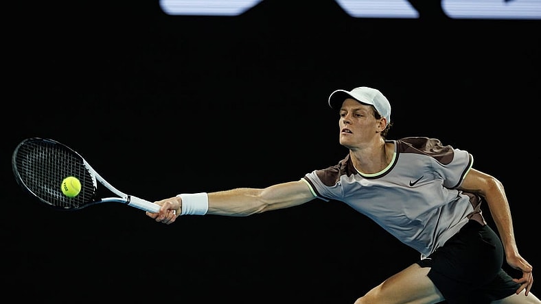 Jan 23, 2024; Melbourne, Victoria, Australia;  Jannik Sinner of Italy in action against Andrey Rublev of Russia in the quarter final of the men s singles. Mandatory Credit: Mike Frey-USA TODAY Sports