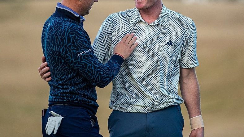 Nick Dunlap (right) embraces Justin Thomas after winning the final round of The American Express at PGA West in La Quinta, Calif., Sunday, Jan. 21, 2024.