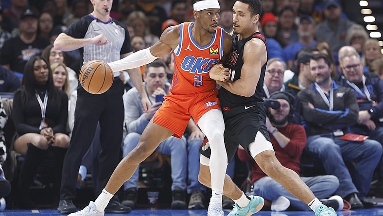 Jan 23, 2024; Oklahoma City, Oklahoma, USA; Oklahoma City Thunder guard Shai Gilgeous-Alexander (2) drives against Portland Trail Blazers guard Malcolm Brogdon (11) during the first quarter at Paycom Center. Mandatory Credit: Alonzo Adams-USA TODAY Sports
