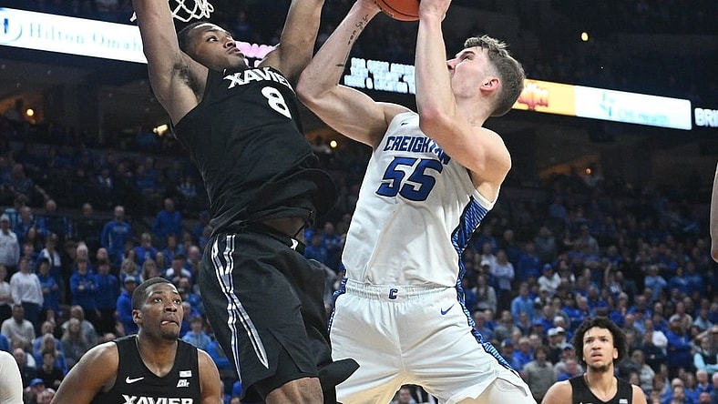 Jan 23, 2024; Omaha, Nebraska, USA;  Creighton Bluejays guard Baylor Scheierman (55) attempts a shot against Xavier Musketeers guard Quincy Olivari (8) in the second half at CHI Health Center Omaha. Mandatory Credit: Steven Branscombe-USA TODAY Sports