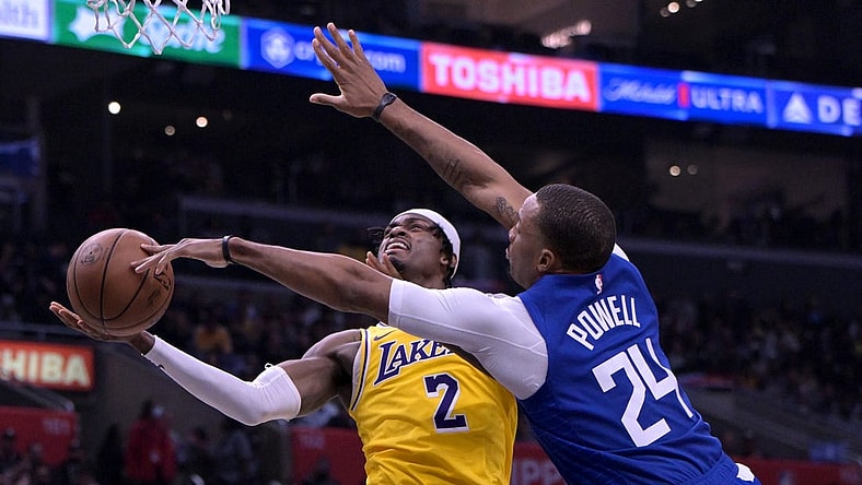 Jan 23, 2024; Los Angeles, California, USA; Los Angeles Clippers guard Norman Powell (24) blocks a shot by Los Angeles Lakers forward Jarred Vanderbilt (2) in the second half at Crypto.com Arena. Mandatory Credit: Jayne Kamin-Oncea-USA TODAY Sports