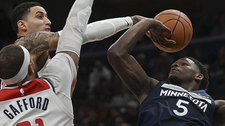 Jan 24, 2024; Washington, District of Columbia, USA;  Washington Wizards forward Kyle Kuzma (33) blocks Minnesota Timberwolves guard Anthony Edwards (5) first half shot at Capital One Arena. Mandatory Credit: Tommy Gilligan-USA TODAY Sports