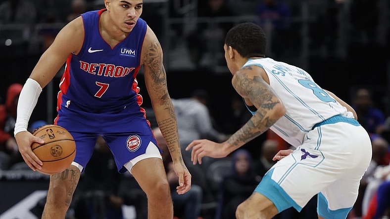 Jan 24, 2024; Detroit, Michigan, USA;  Detroit Pistons guard Killian Hayes (7) dribbles defended by Charlotte Hornets guard Nick Smith Jr. (8) in the first half at Little Caesars Arena. Mandatory Credit: Rick Osentoski-USA TODAY Sports