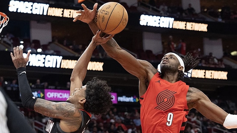 Jan 24, 2024; Houston, Texas, USA; Houston Rockets guard Jalen Green (4) is fouled by Portland Trail Blazers forward Jerami Grant (9) in the second quarter at Toyota Center. Mandatory Credit: Thomas Shea-USA TODAY Sports